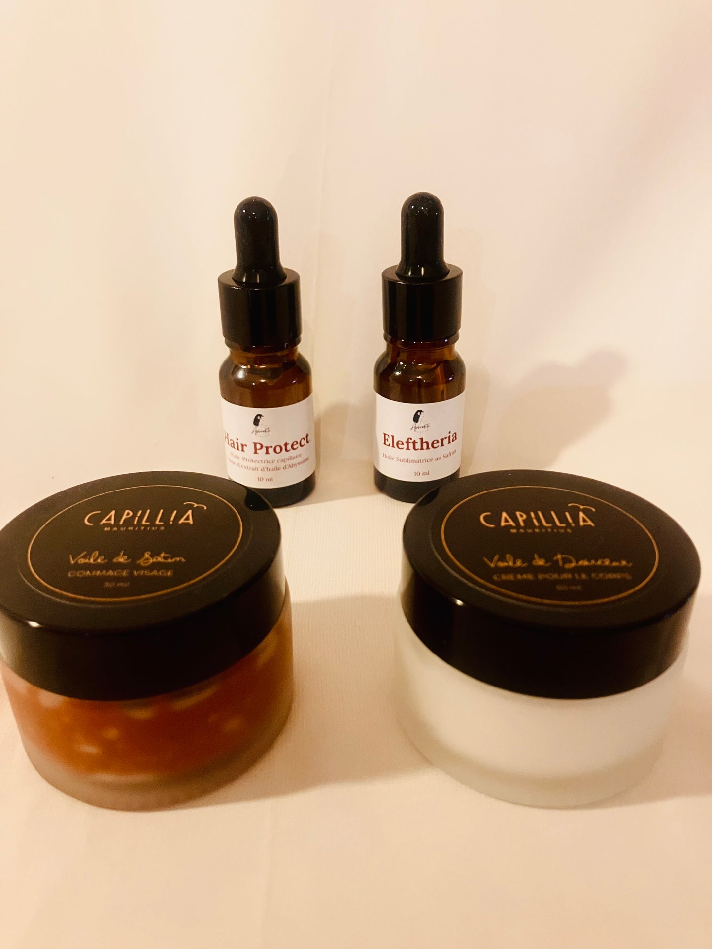 Pochette Signature Sérum visage 10ml + Sérum cheveux 10ml + gommage visage 30ml + creme corps 30ml